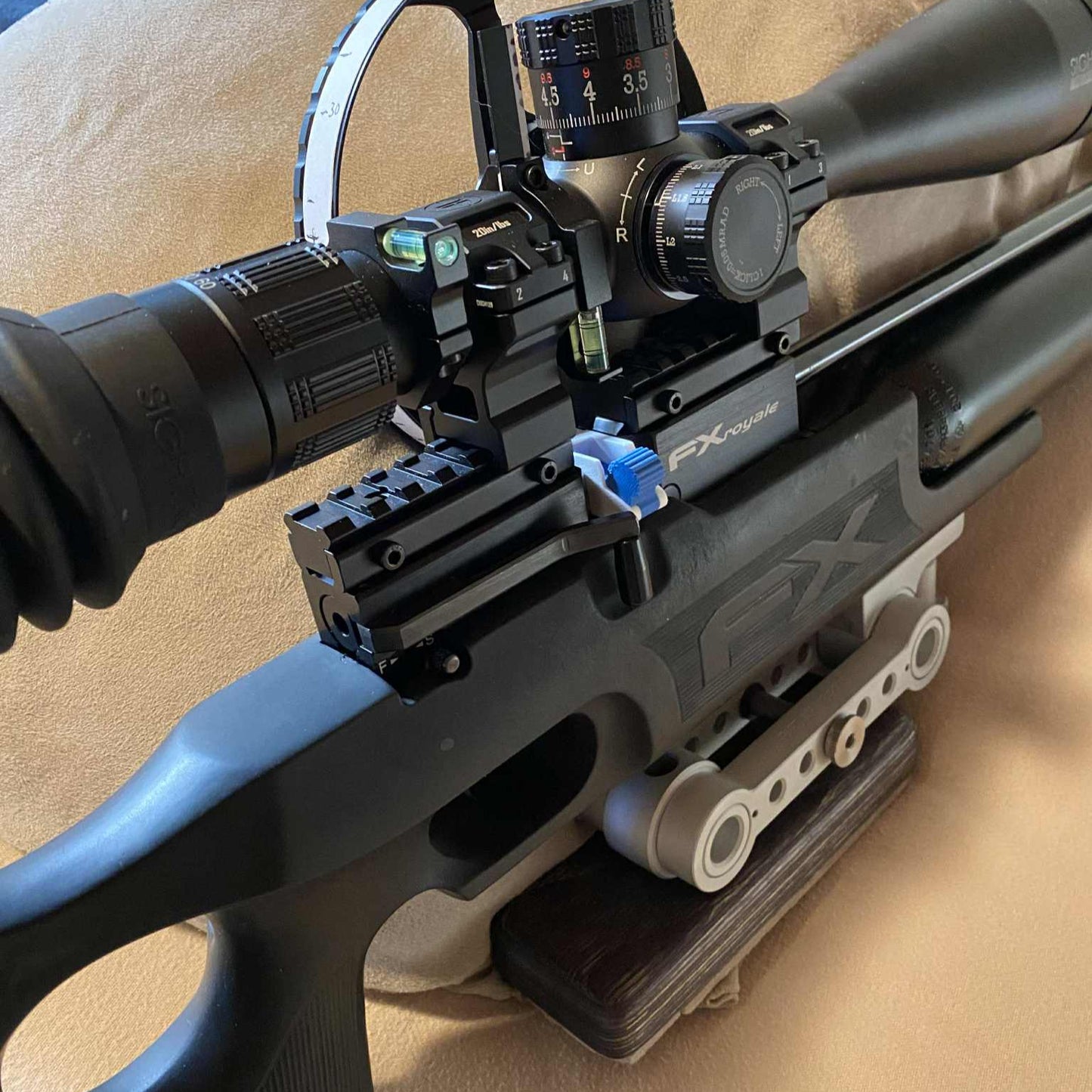 Single shot loader attached to rifle in closed position